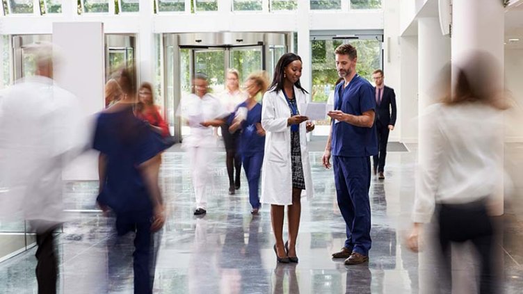 Image of healthcare workers in hospital atrium