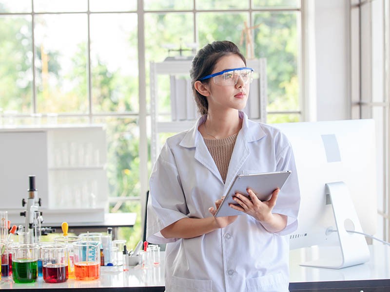 A girl holding tablet in Lab