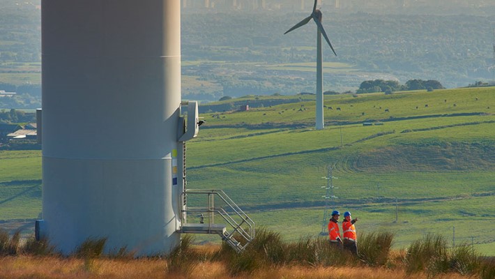 Engineers team working in wind turbine farm