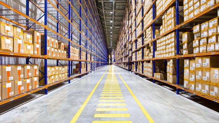 Huge shelves containing boxes in warehouse