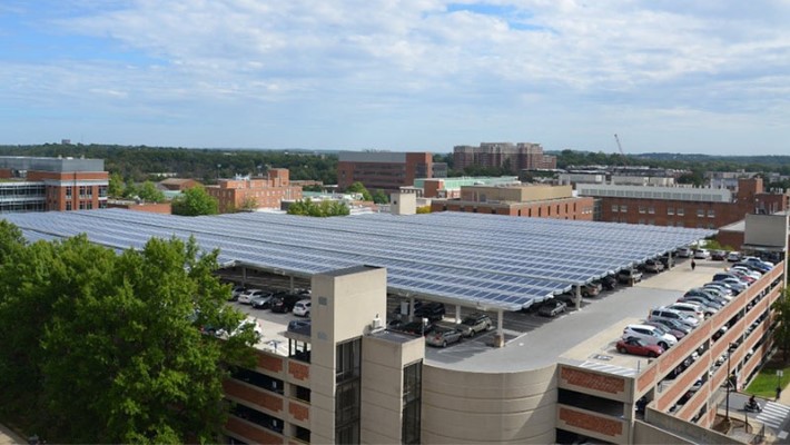 Aerial view of solar planels placed above the building.
