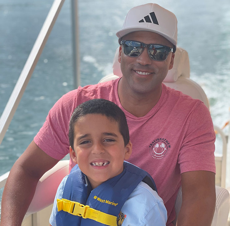 Chris Drew enjoying a day out on the water with his son, Luke.