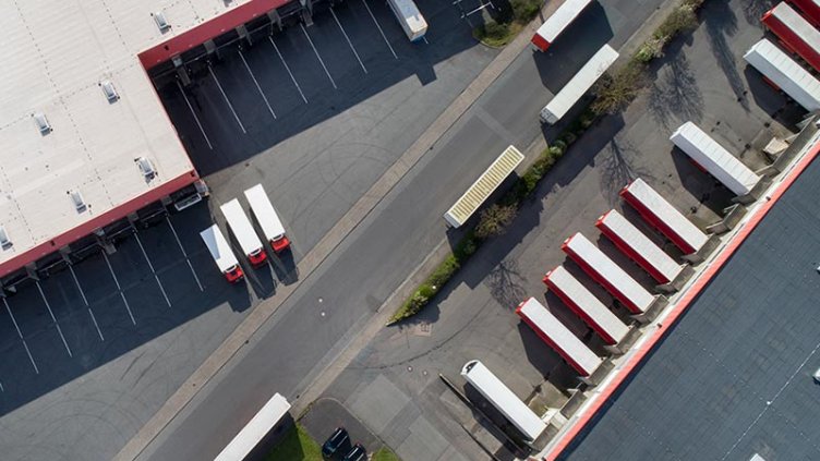 Aerial view of logistics center with trucks