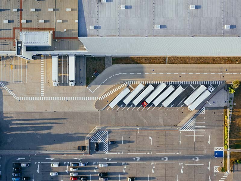 Aerial view of trucks stationed at a loading dock