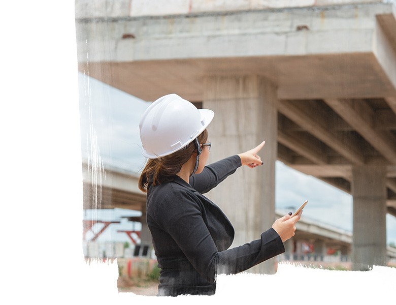 Female engineer working at the site of a bridge that is under construction