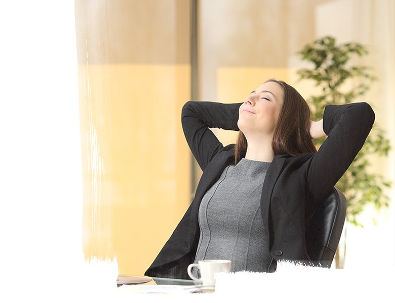 Relaxed executive breathing fresh air at the office