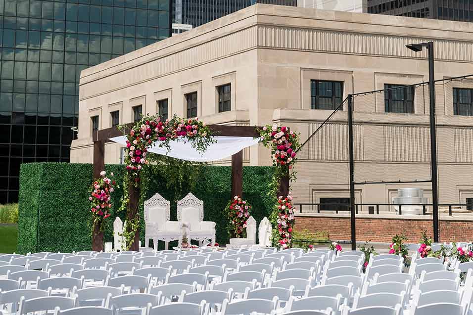 View of a wedding ceremony setup on the Meadow rooftop space at Chicago's Old Post Office building