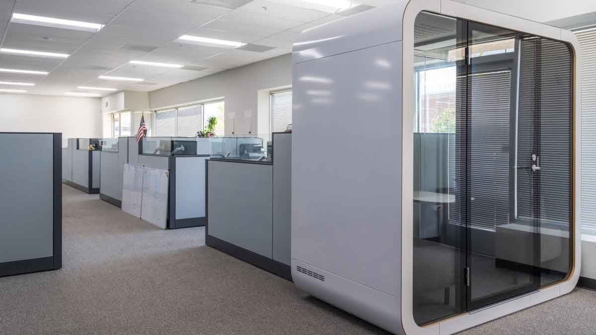 View of privacy pods inside a real estate office building