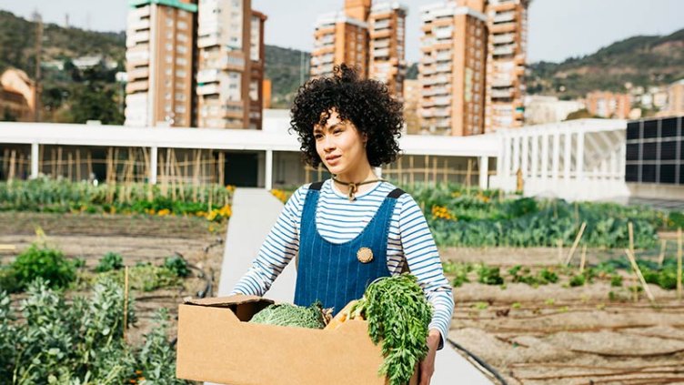 A woman holding a vegetable basket