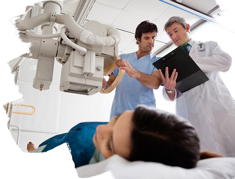 Picture of two doctors discussing something while examine a lady