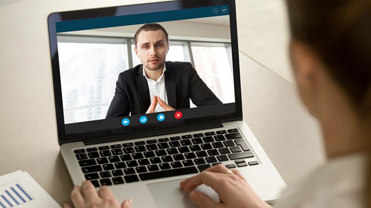 Picture of employees conducting virtual online meeting