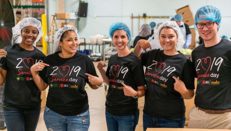 Group image of JLL employees on a food depository service day