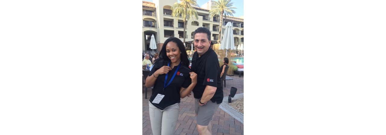 Donielle Watkins and a colleague outside at a JLL