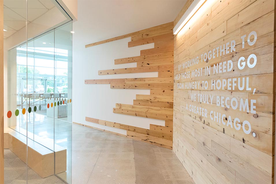 Bright airy walkways showcase the non-profit's mission on the wall