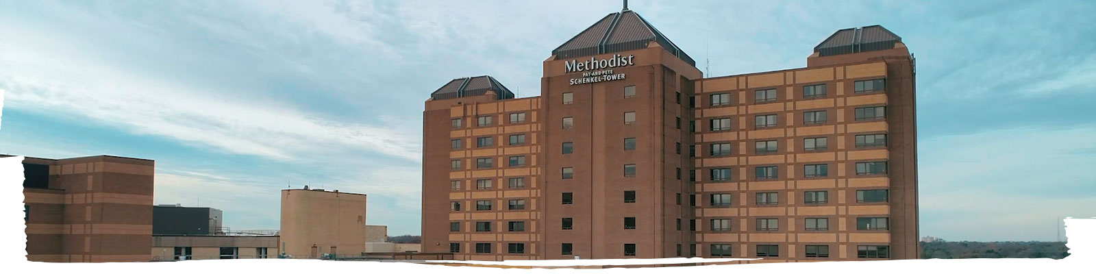 A wide shot of a Methodist hospital building
